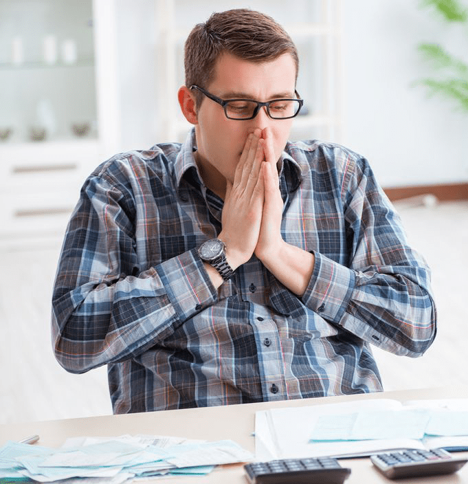 man frustrated with paperwork